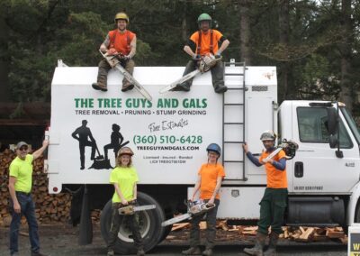 tree guys and gals posing on truck - free estimates